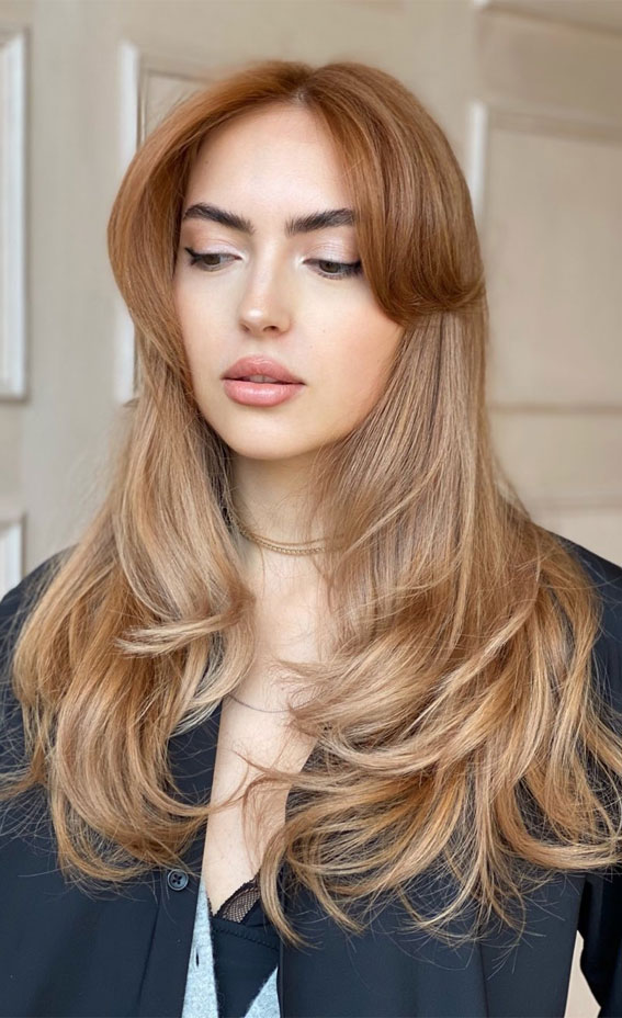 40 Best Layered Haircuts & Hairstyles For 2022 : Peach Blonde Layered Haircut with Curtain Bangs