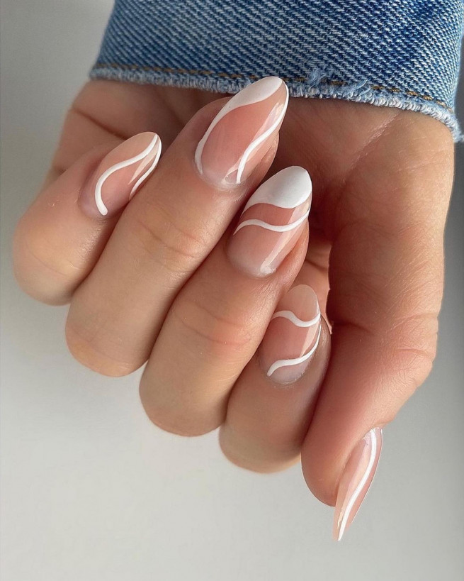 nude nails with white lines, nude nail designs 2022, nude nails 2022, classy nude nails, nude nails with design, acrylic nails with white outline, almond nails with white lines, white line nail design, white swirl nails, white french nails, almond nails, white swirl almond nails