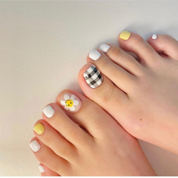 Premium Photo | Beautiful female feet with fashion pedicure nails pink  white and black gel polish heart design