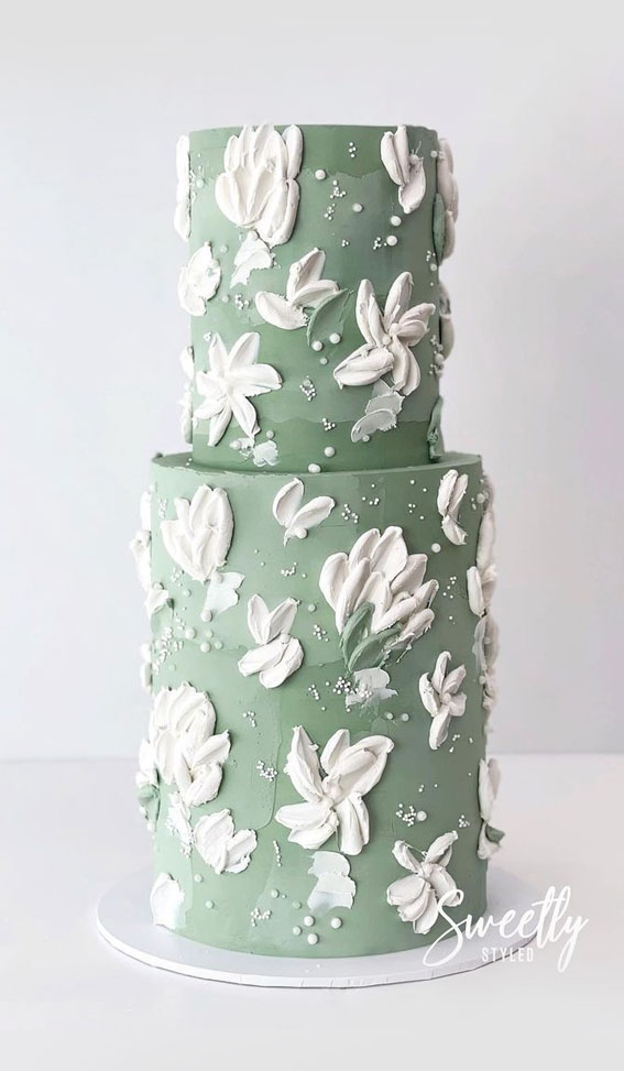 50 Cute Buttercream Cake Ideas for Any Occasion : Soft Green Cake with Flowing White Flower