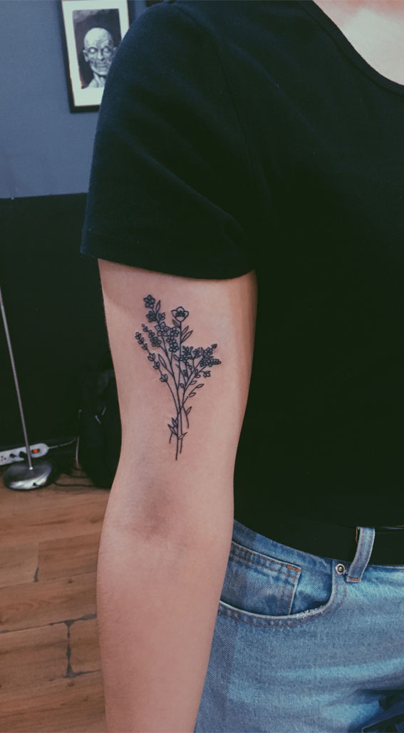 Black minimal flower tattoo on the inner arm  Tattoogridnet