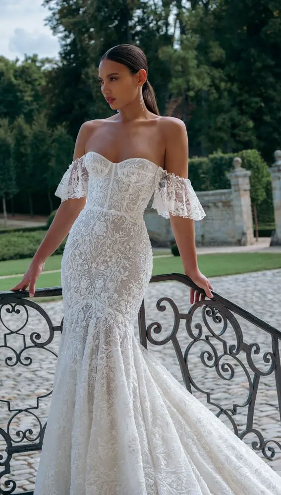 wedding dress fabric, wedding dress fabric with pictures, lace wedding dress, illusion off-the-shoulder sleeves frame the strapless sweetheart corset.