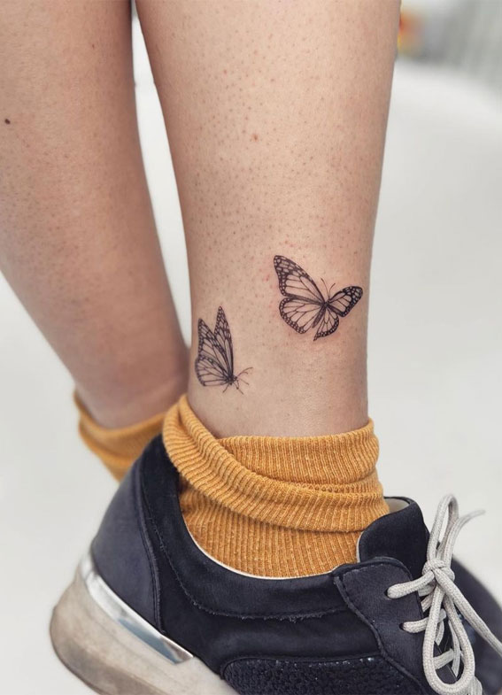 Cute small butterfly tattoo on leg