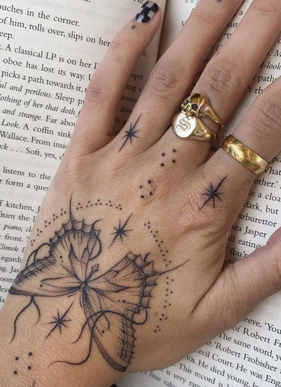 Butterfly geometric hand tattoo