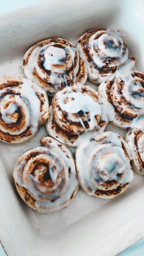 Feast for the Senses Captivating Food Aesthetics : Cinnamon Rolls Topped with Icing Sugar