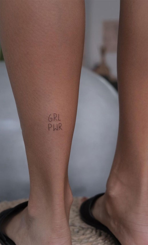 39 Inked Sentiments Exploring Meaningful Tattoos : Girl Power Tattoo on Back Leg