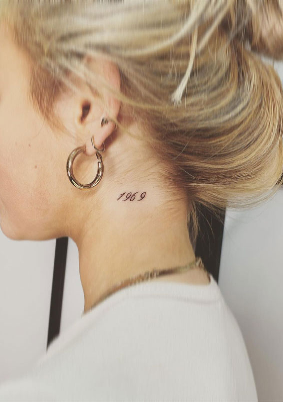 39 Inked Sentiments Exploring Meaningful Tattoos : Year 1969 Tattoo on Neck