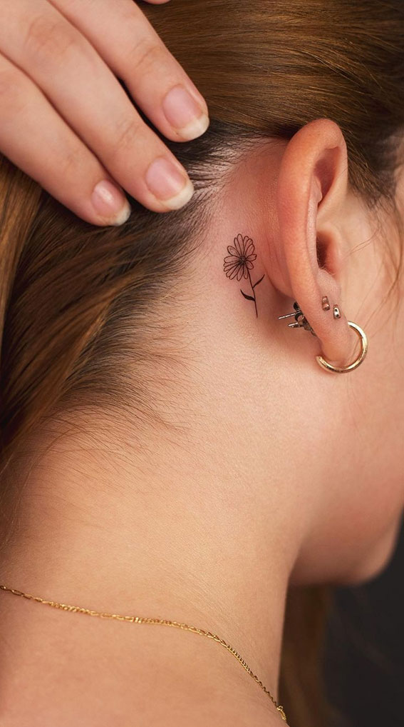 Ink Fusion Where Art and Identity Meet : Flower Behinds Ear Tattoo