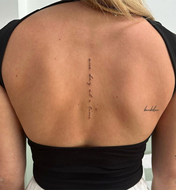50 Small Tattoo Ideas Less is More : Dainty Script Down the Spine