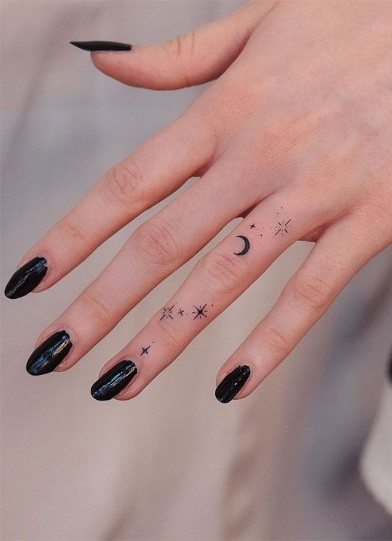 Ink Fusion Where Art and Identity Meet : Moon & Stars Tattoos on 4th Finger