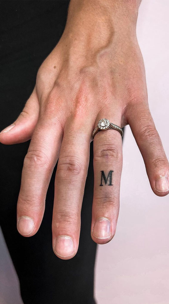 50 Small Tattoo Ideas Less is More : Initial M Tattoo on 4th Finger
