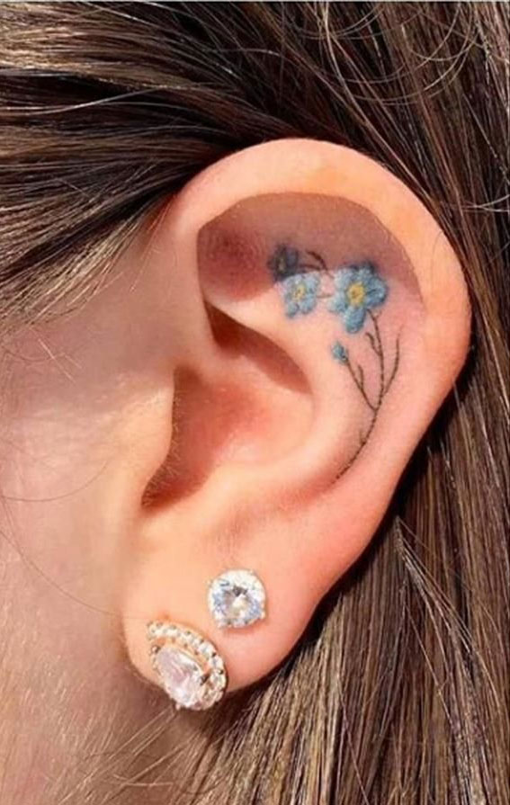 Whispered Ink 40 The Beauty of Ear Tattoos : Blue Flower Inside Ear Tattoo