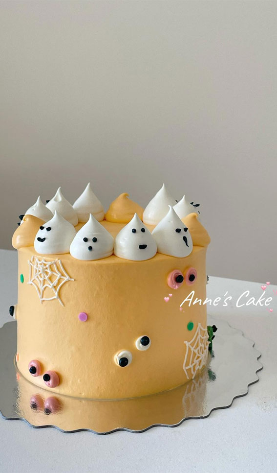 Halloween Cake Ideas to Haunt Your Taste Buds : Soft Yellow Buttercream Cake Topped with Ghosties