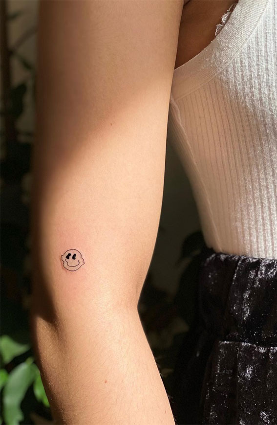 Tiny Treasures Meaningful Small Tattoo Inspirations : Groovy Smiley Face Tattoo on Arm