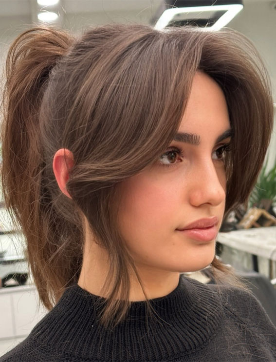 Chic & Versatile Layered Haircuts & Styles : Cute Ponytail Features Curtain Bangs