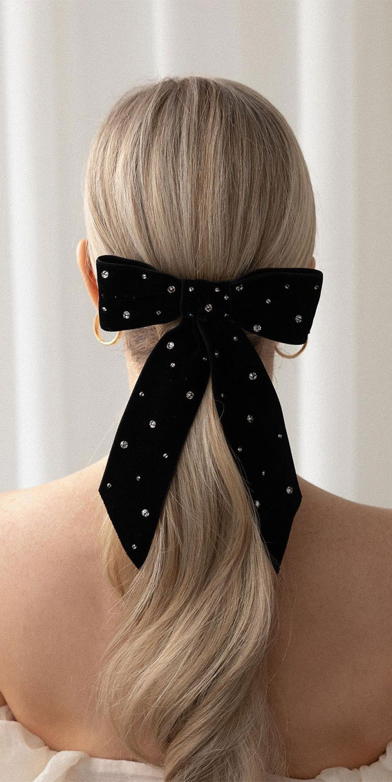 On-Trend Bow Hairstyles for a Chic and Playful Look : Ponytail with Elegant Black Bow