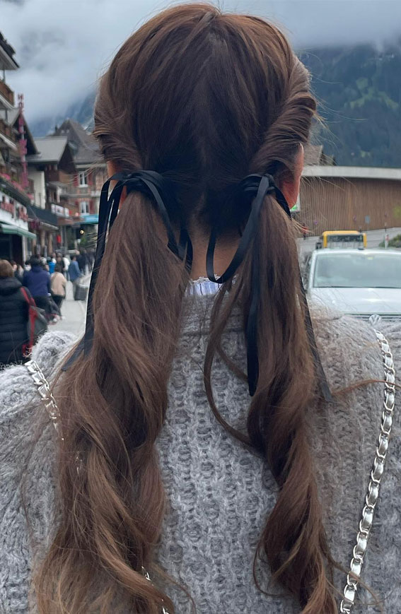 On-Trend Bow Hairstyles for a Chic and Playful Look : Swept Side Pigtail with Bows