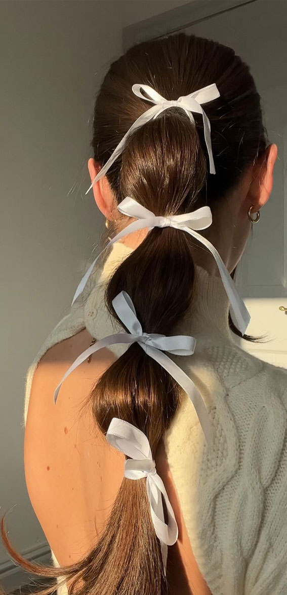 On-Trend Bow Hairstyles for a Chic and Playful Look : White Bows Tied Up Sleek Bubble Braids
