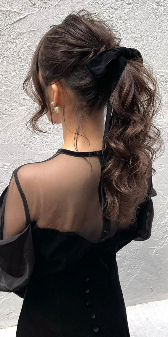 On-Trend Bow Hairstyles for a Chic and Playful Look : Voluminous Pony Bow Glam